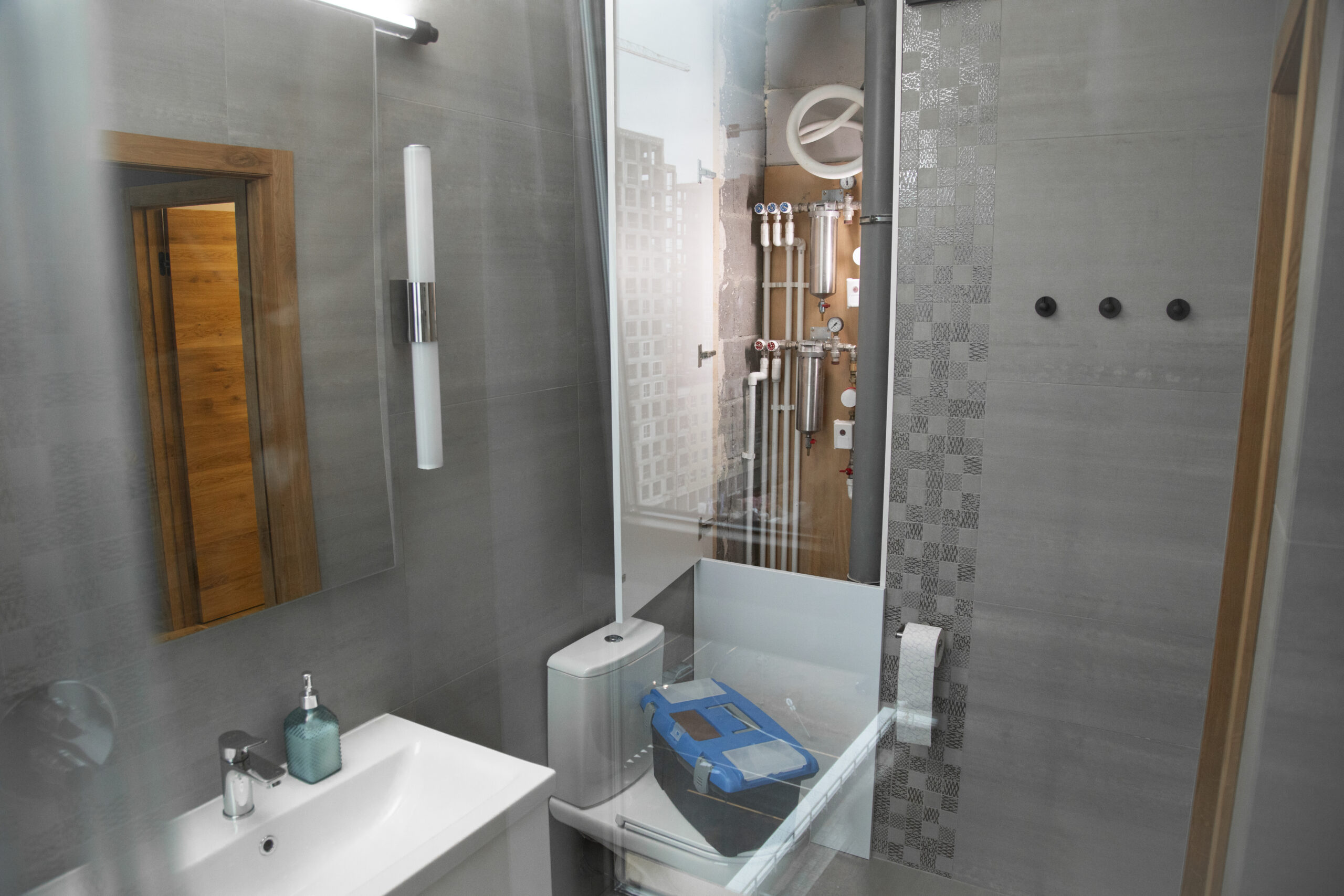 Small Bathroom Renovation: 7 Amazing Ways to Maximize Storage (Proven Guide) 1 view plumber tool box ready fixing problems bathroom scaled TheHomeQuality