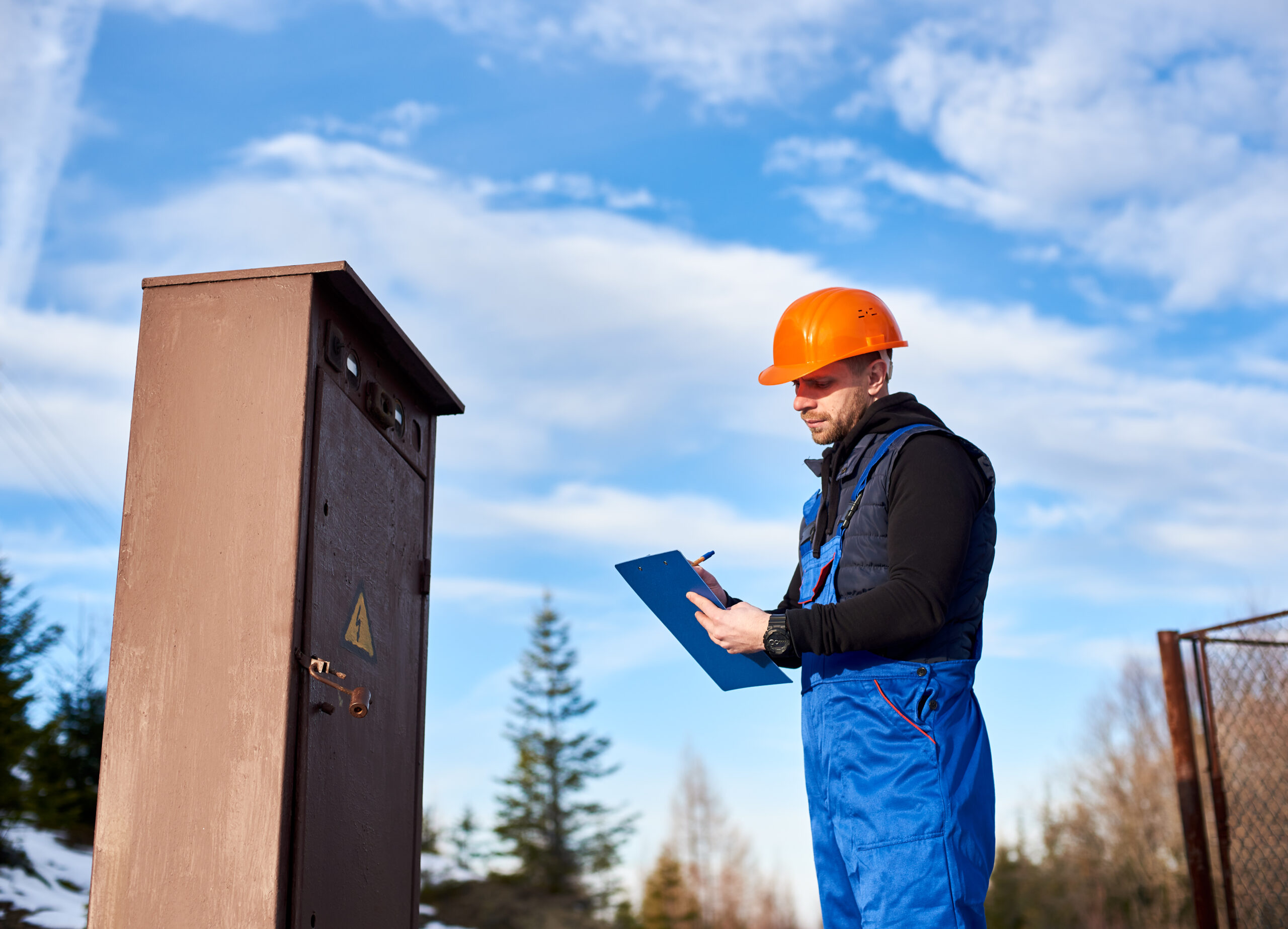 oil inspector protective overalls orange helmet making notes transformer scaled TheHomeQuality